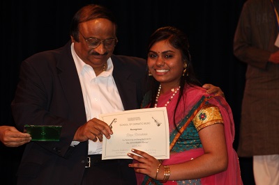 Mr. Lakshminarayan presents Divya, our emcee and graduating senior her certificate