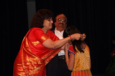 Mr. and Mrs. Lakshminarayan present the awards